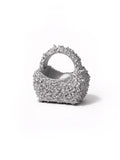 Silver textured handbag on a white background