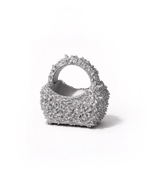 Silver textured handbag on a white background
