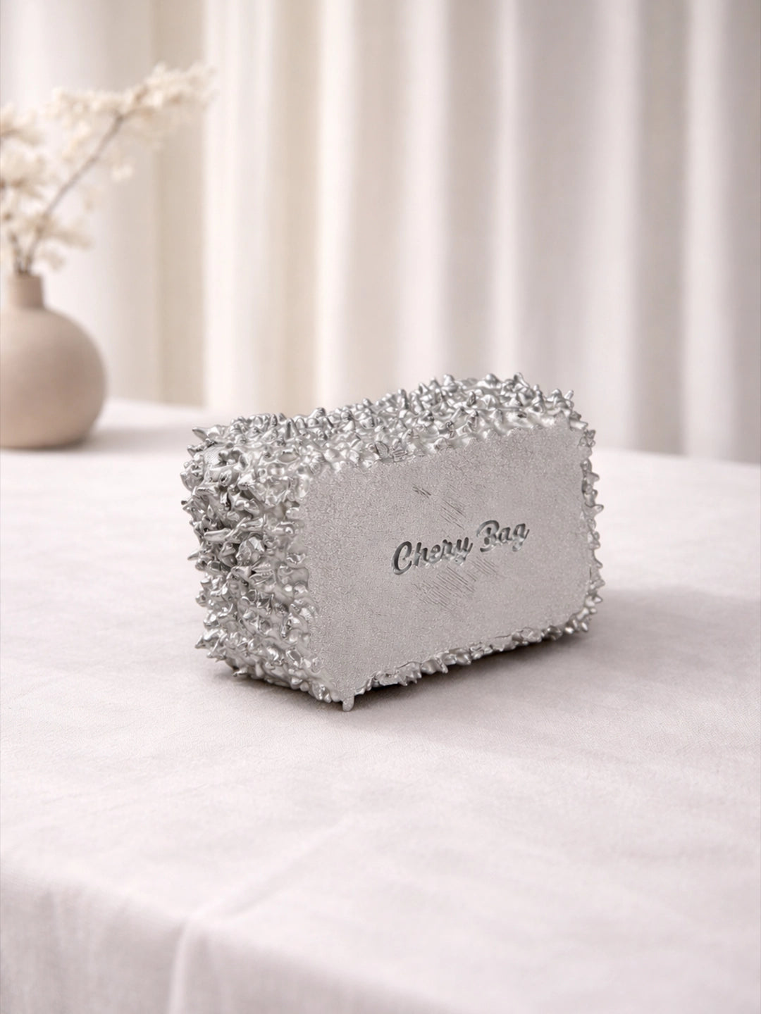 Decorative box with 'Cherry Bag' branding on a white surface with a neutral background